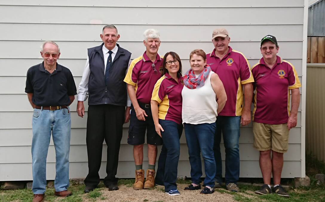 POETRY: Local poets David Rowe (second from left) and Tammy Roberts (third from right) with Denman Lions Club members Gary Newton, Keith Murray, Tracy Ward, Steve Carter and Martin Byrne.