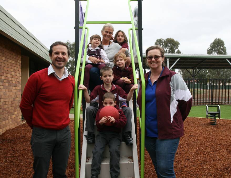 NEW SLIDE: Muswellbrook South Primary School’s principal, Glen Kite, assistant principal of the support class Jan Ireland and P&C president Gina Philpott with Chase, Laughlan, Ava, Ella and Eligh in the new playground.