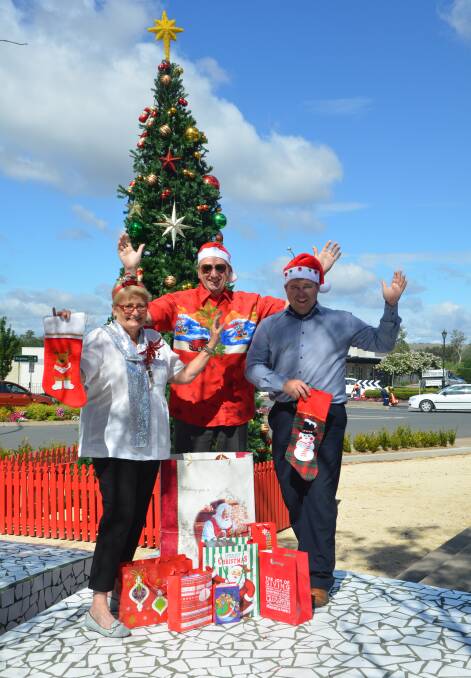 BUY LOCAL: Lorraine Skinner, Mike Kelly and Ross Peasley encourage locals to shop locally this Christmas. The three are the treasurer, president and vice president of Muswellbrook Chamber of Commerce and Industry.