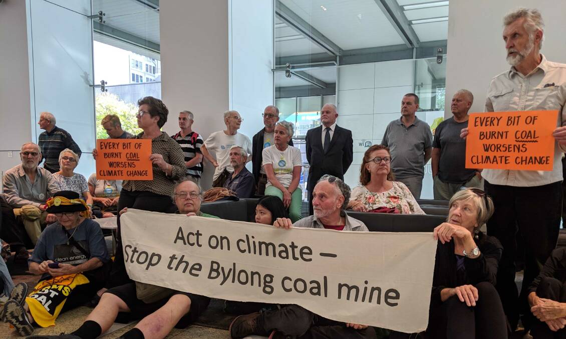 Sit-in: Bylong farmers backed by Lock the Gate take a seat at the Independent Planning Commission on Tuesday as the commission decides on the controversial Korean Government-backed Bylong coal mine.