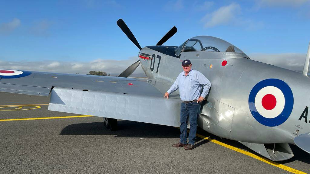 LOOK UP: Upper Hunter Shire Council Mayor Maurice Collison standing next a CAC Mustang which will be on display during Warbirds over Scone on March 26-27. 