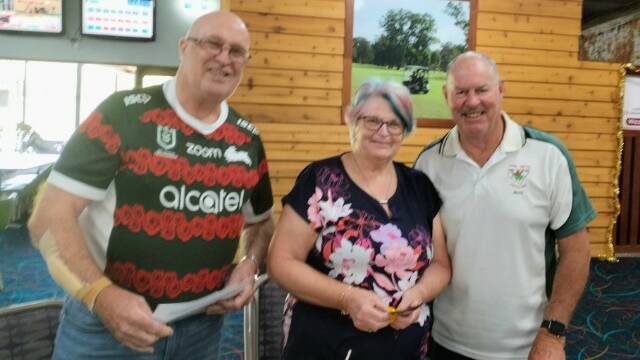 Bruce Robinson, right, is congratulated on his 44 Stableford points to win the Morley's Mulligan's event at Muswellbrook on November 29. He is with Gary Morley and Pauline. Picture: Supplied.