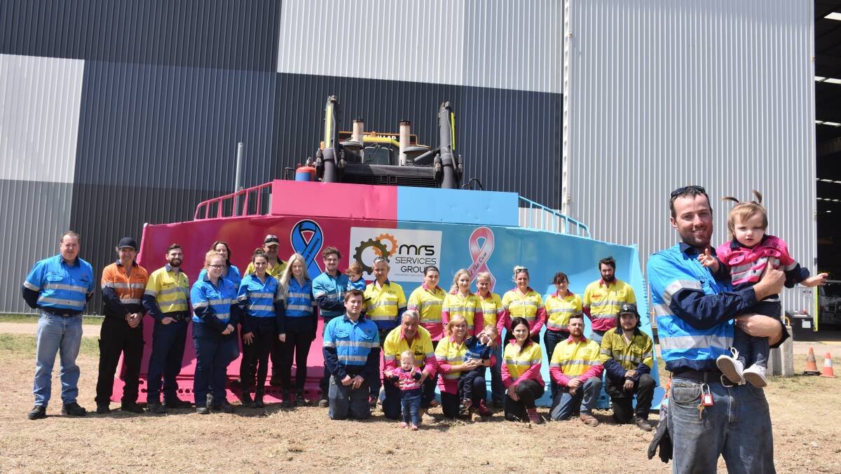 THINK PINK AND BLUE: MRS Services Group employees and family members with their coloured shirts and painted bucket.