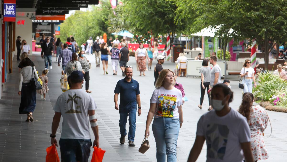Shoppers in Crown Street Mall the day after COVID check-in and mask restrictions eased. Photo: Adam McLean
