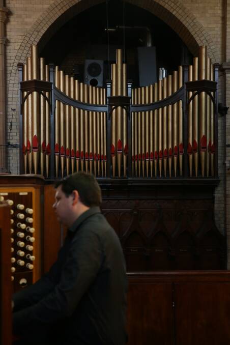 Peter Guy playing Christ Church Cathedral's organ. Picture: Simone De Peak