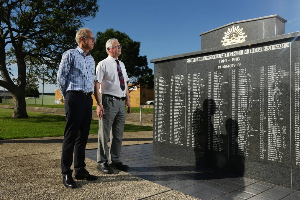 REMEMBRANCE: Professor Hubert Hondermarck and Professor Jim Denham at the war memorial in Federal Park, Wallsend. Picture: Jonathan Carroll
