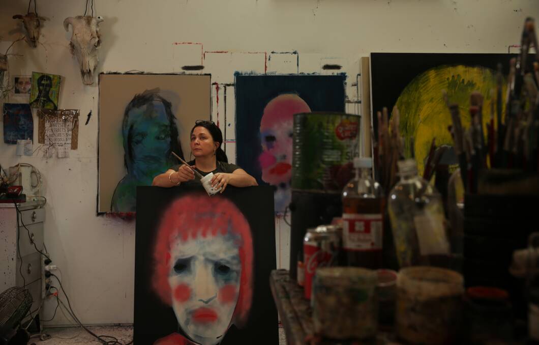 Artist Sally Bourke in her studio in the shed. Picture: Simone De Peak