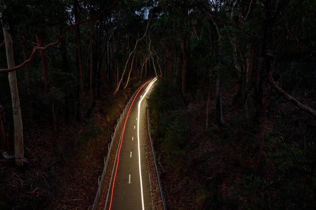 A cyclist riding past Fernleigh Loop in the early evening. Picture: Max Mason-Hubers 