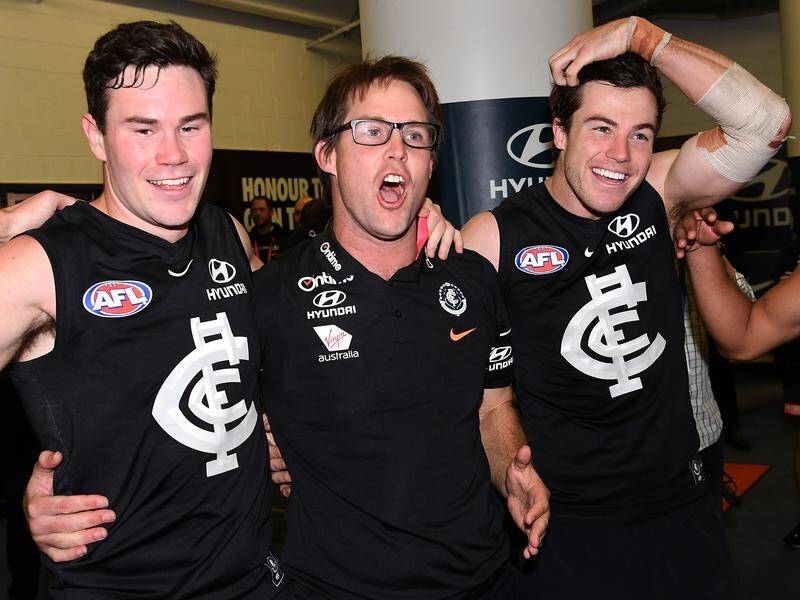 David Teague (c) is hoping for back-to-back wins to start his Carlton interim coaching role.