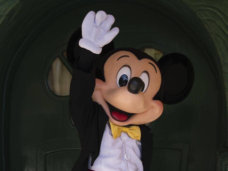 Mickey Mouse is practisng social distancing as Disneyland in California reopens to limited visitors.