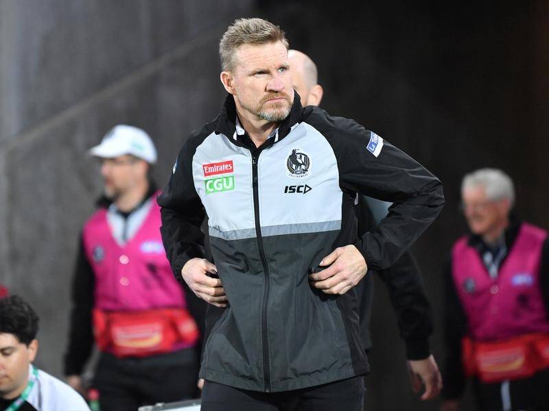 Nathan Buckley is safer keeping his hands to himself after a fist bump with a fan was investigated.