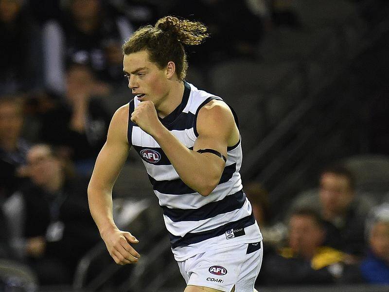 Former Geelong forward Wylie Buzza has been signed by Port Adelaide.