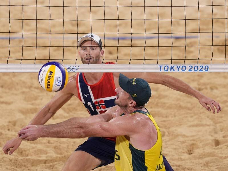 Chris McHugh in action, shadowed by Anders Bernsten Mol, during Australia's beach volleyball loss.