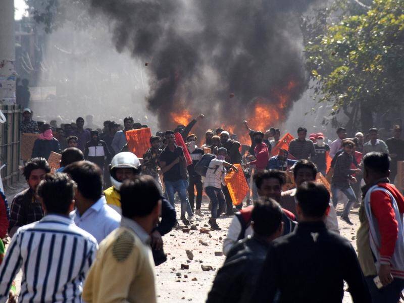 At least seven people have been killed in New Delhi as thousands protest a new citizenship law.