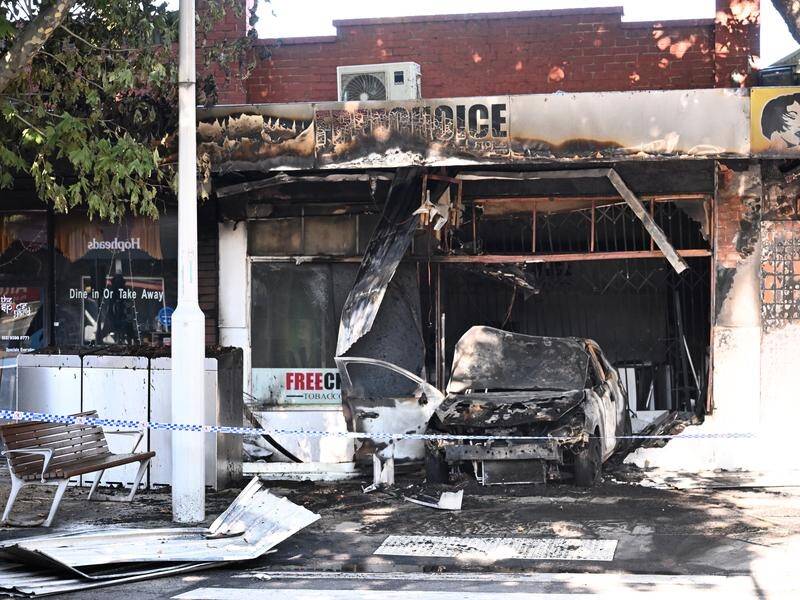A man has been charged over a carjacking and three arsons, including at an Altona tobacco store. (Joel Carrett/AAP PHOTOS)