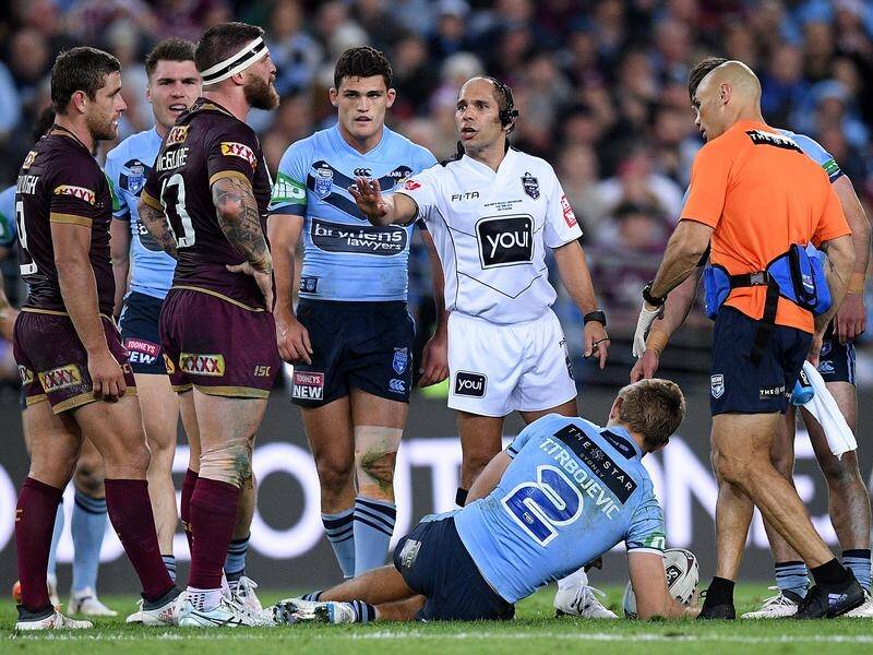 Referee Ashley Klein (centre), pictured officiating during last year's Origin, has been dropped.