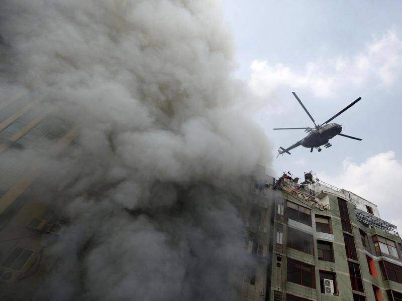 The fire broke out around lunchtime in a 19-storey commercial building in Dhaka, Bangladesh.