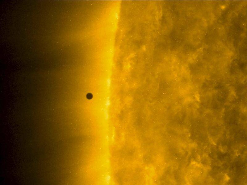 NASA's Solar Dynamics Observatory image shows Mercury as it passes between earth and the sun.