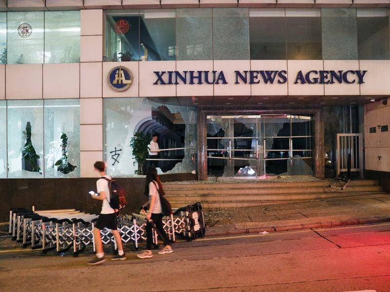 A former Xinhua Sydney bureau chief has criticised Australian authorities for raiding his home.