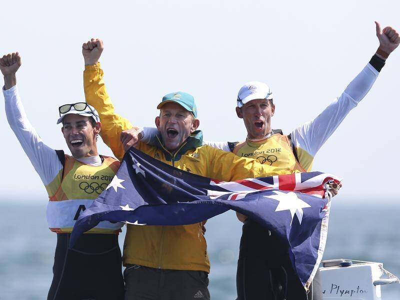 Victor Kovalenko with 2012 Olympic sailing champions Mathew Belcher (l) and Malcolm Page (r).