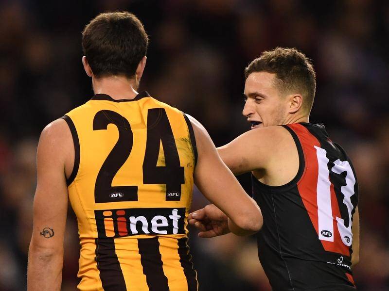 Hawthorn's Ben Stratton (left) could end up in hot water for pinching Essendon's Orazio Fantasia.