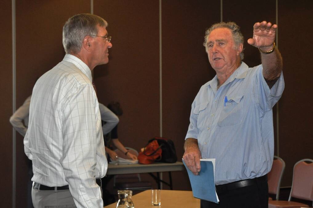 Planning Assessment Commission Chair, Garry West, in conversation with Wybong landholder, Ernest Markham.