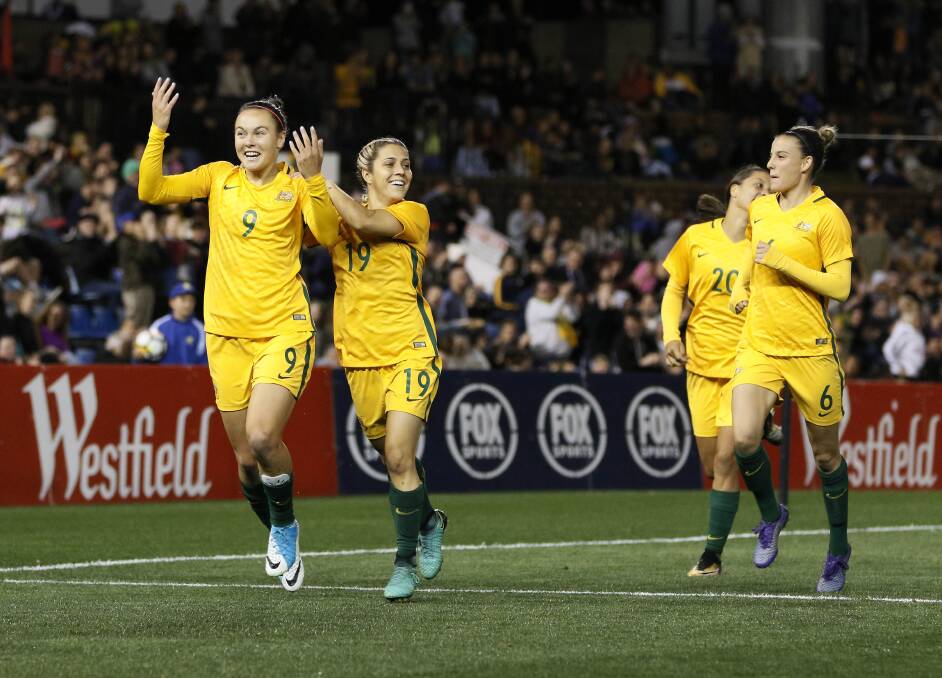 Caitlin Foord (left) celebrates after scoring a goal during the match between the Matildas and Brazil at McDonald Jones Stadium on Tuesday. Picture: AAP