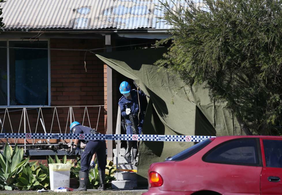 Fire investigators at Stockton on Monday morning after the body of Graham Cameron was found. Picture: Simone De Peak