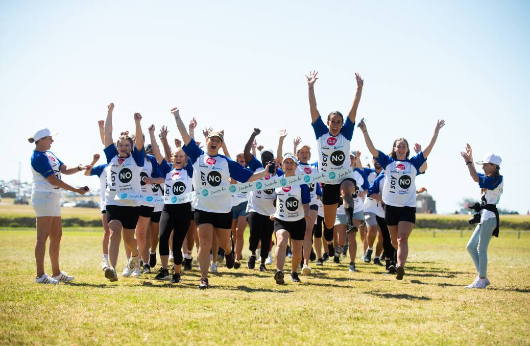 Participants in the 'I Run for Her' event, started by family violence charity Got Your Back Sista, at Empire Park on Sunday. Picture by Jonathan Carroll 