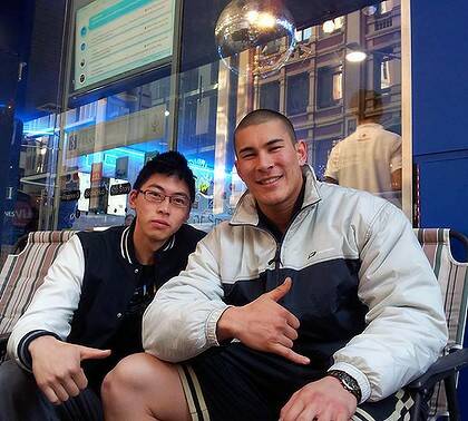 John Kim, 19, and Russell Lee, 20. John plans to sell his $2 Galaxy S II and Russell plans to keep his.