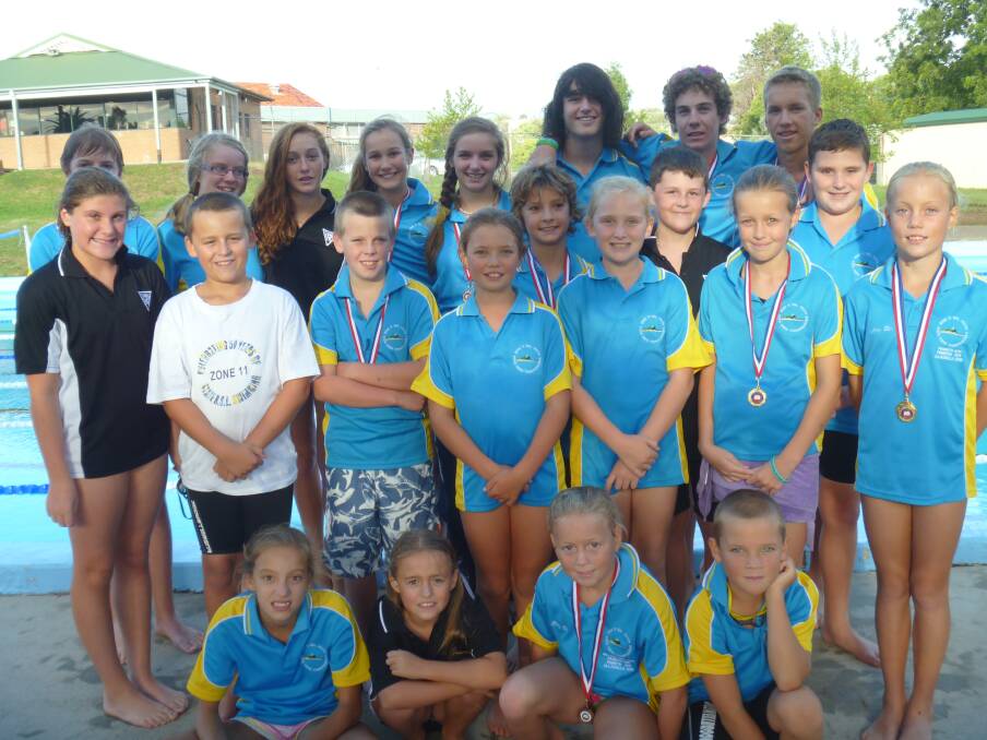 SUCCESSFUL CAMPAIGN: Muswellbrook Amateur RSL Youth Swimming Club members, back from left, Ryan Lockhart, Jackie Lockhart (captain), Nicole Boeckx, Polly Britten, Maddy Hamson, Will Moore, Jordan Solly, John Langley (captain); third row from left, Joseph Hamson, Tom Small , Kye Reynolds; second row from left, Isobel Bates, Issak Small, Hayden Bull, Meg Southcombe, Shae Reynolds, Lucy Britten, Abbey Ellis and, front from left, Olivia Hamson, Alice Small, Chelsey Ellis and Wil Southcombe. Absent: Bailey Ellis, Shawn Honeysett, Stephen Langley