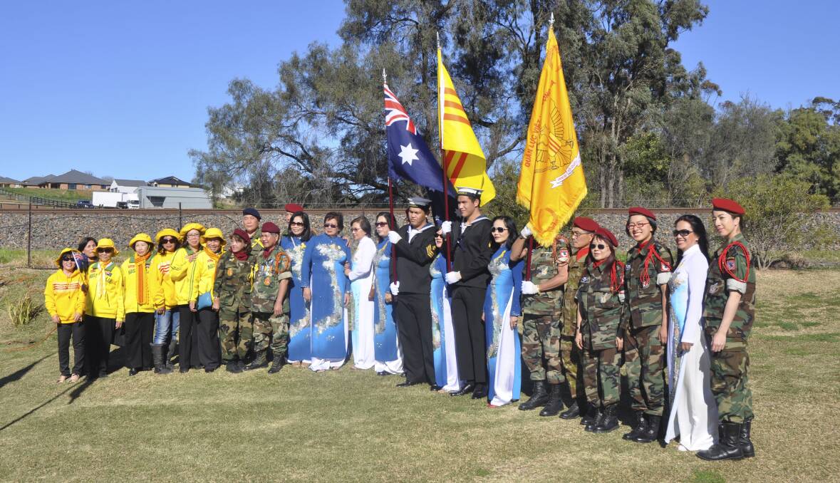 FLYING THE FLAG: More than 130 Vietnamese travelled from the South Coast to participate in Sunday’s proceedings at Muswellbrook.